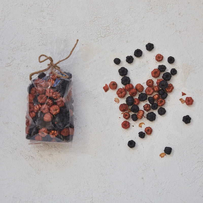 Clear bag tied with twine featuring dried natural pumpkin shaped mix with black and orange berries