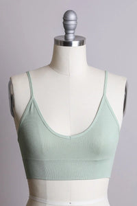 Close-up of a dress on a mannequin showcasing the LOW BACK SEAMLESS BRALETTE to stay comfy