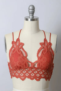 Close-up of a dress with a mannequin showcasing a Padded Crochet Lace Longline Bralette