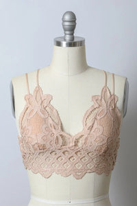 Close-up of a Padded Crochet Lace Longline Bralette on a mannequin with white background