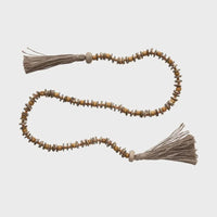 Close up of Mango Wood Bead Garland with Jute Tassels showcasing elegant design