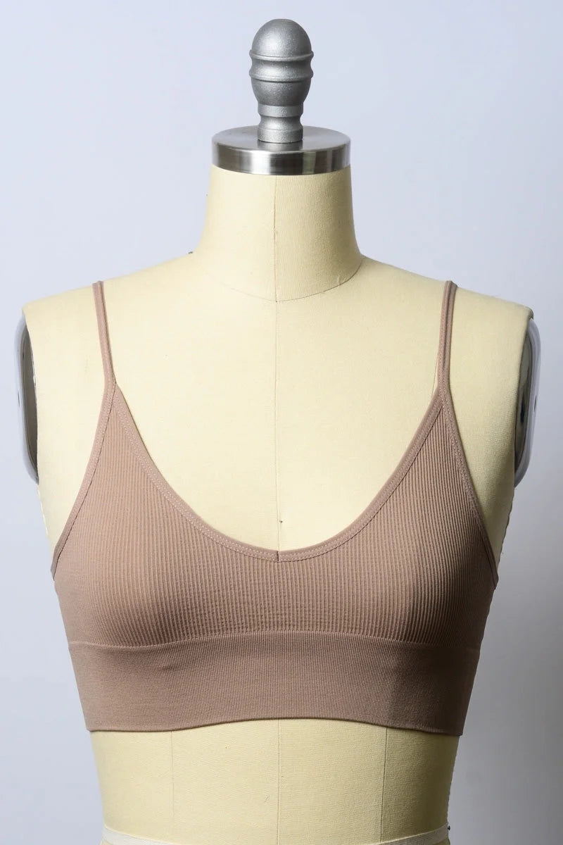 Close-up of a mannequin torso wearing a brown seamless bralette for effortlessly chic comfort