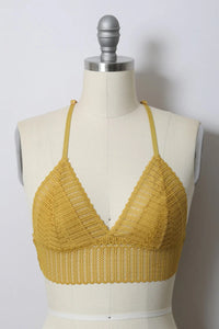 Close-up of a mannequin torso featuring a Ribbed Lace Boho Racerback Bralette in yellow