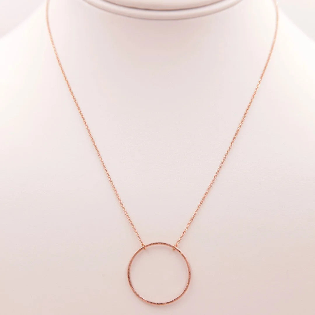 Close-up of a Circular Pendant Necklace displayed on a mannequin for stylish presentation