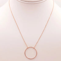 Close-up of a Circular Pendant Necklace displayed on a mannequin for stylish presentation