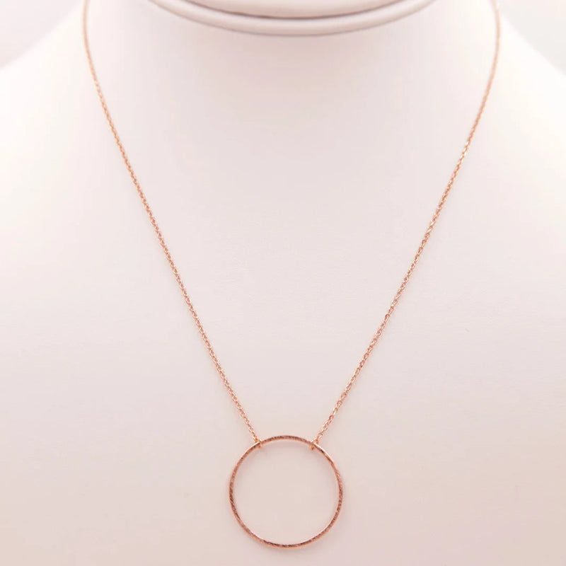 Close-up of a Circular Pendant Necklace displayed on a mannequin for stylish presentation