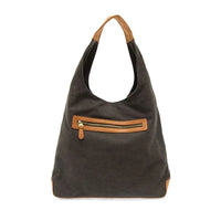 Close-up of APRIL CANVAS HOBO BAG with zipper, featuring adjustable shoulder strap and brass plated hardware