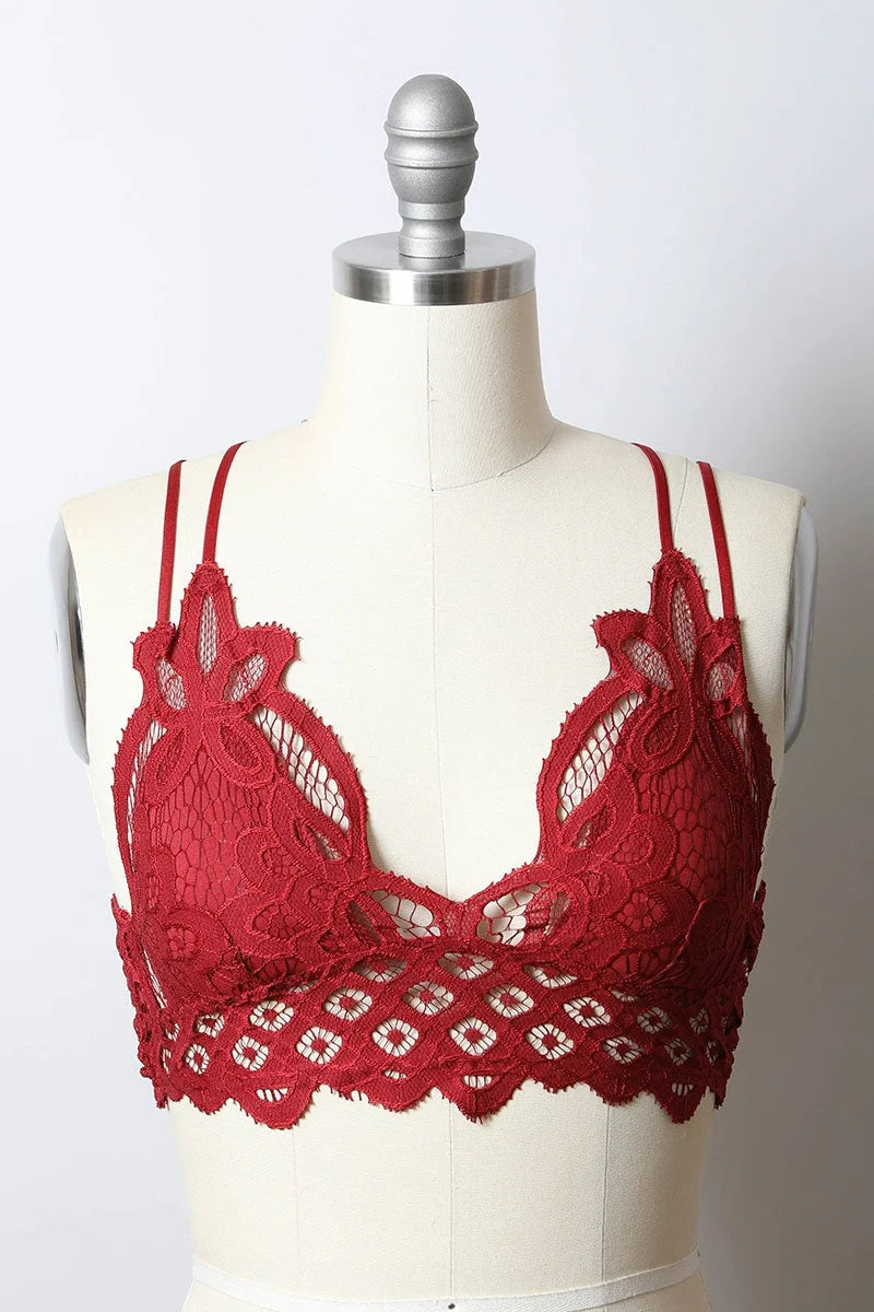 Close up of a red padded crochet lace longline bralette on a mannequin