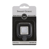 Close up of a small clock in the Auto Car Vent Sweet Grace package