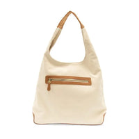 Close up of APRIL CANVAS HOBO BAG featuring brass plated hardware and adjustable shoulder strap