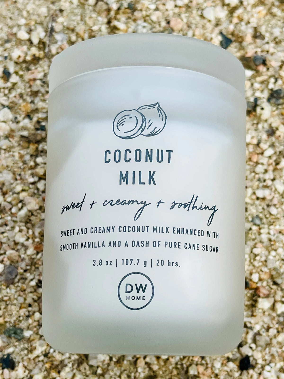 Coconut Milk Body Scrub beside COCONUT MILK MINI CANDLE in a boho setting