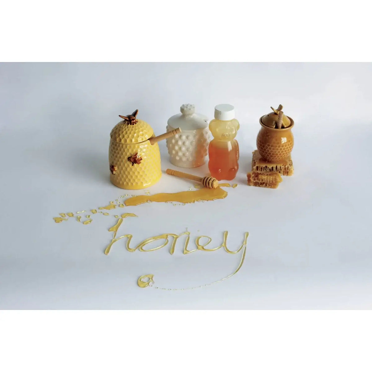 Decorative honey jars and dipper showcasing the essence of honey and boho chic style