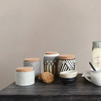 Stoneware mini bowl with ceramic jars and small dishes for stylish kitchen decor