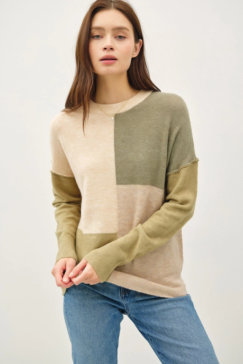 Color blocked crew neck sweater in beige, olive, and sage green sections