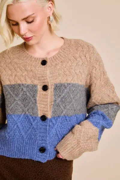 Color-blocked cropped sweater cardigan in beige, grey, and blue stripes with black buttons