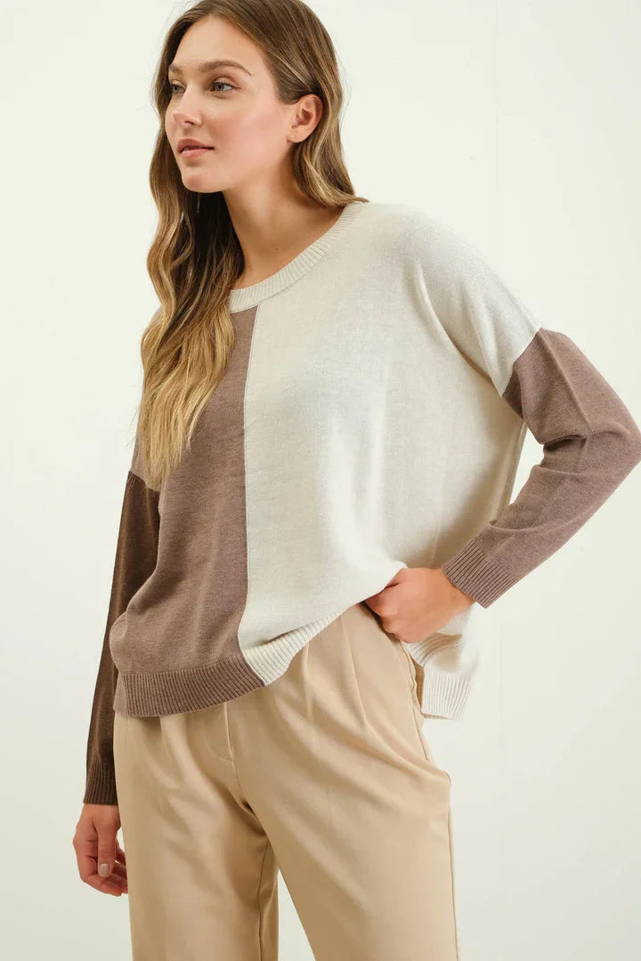 Relaxed colorblock sweater featuring cream and taupe sections for a stylish look