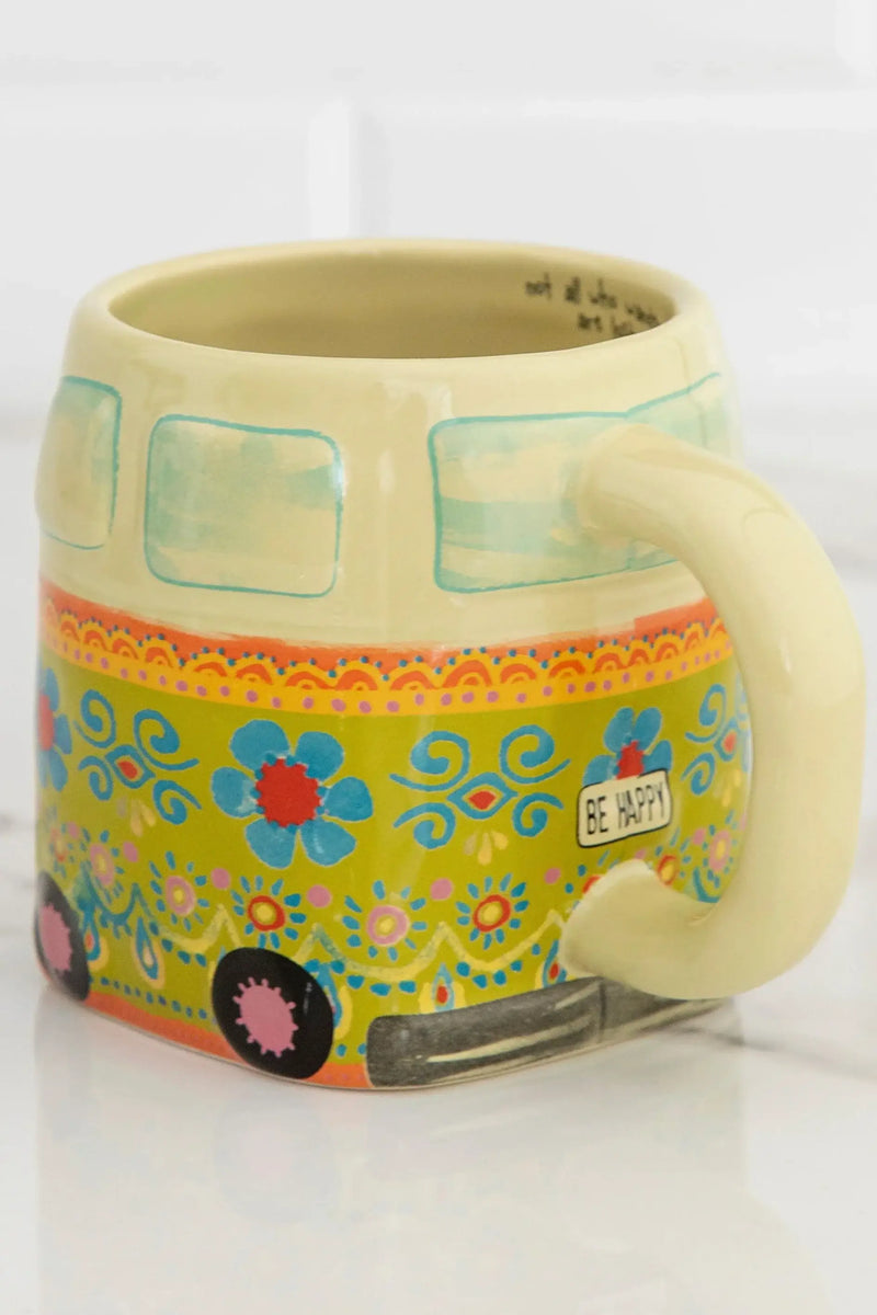 Colorful ceramic VW bus-shaped Folk Art coffee mug with floral and hippie patterns