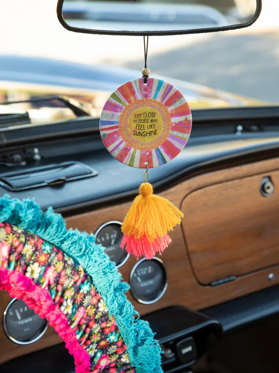 Colorful boho circular car air freshener with tassel for a free spirit vibe