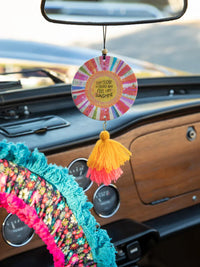 Colorful boho circular car air freshener with tassel for a free spirit vibe