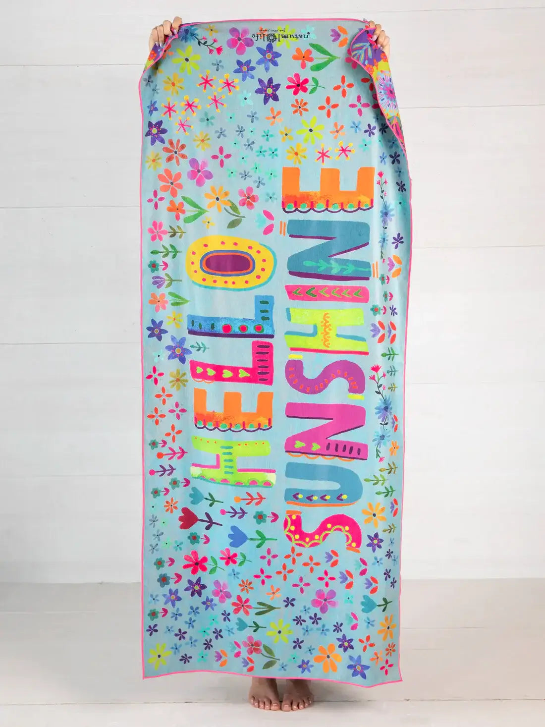 Colorful floral beach towel from boho chic boutique online for Jacksonville Beach relaxation