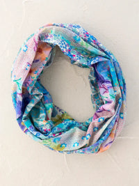 Colorful floral infinity scarf featured in women’s boho chic clothing by Shop Daisy