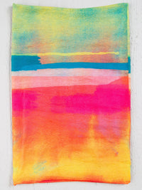 Colorful painting on white wall showcasing FULL BOHO BANDEAU HEADBAND - RAINBOW OMBRE