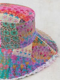 Colorful watercolor patchwork bucket hat from Shop Daisy, perfect for women’s boho chic clothing