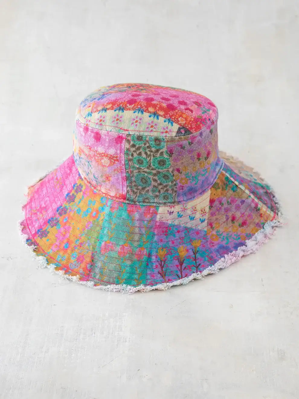 Colorful watercolor patchwork bucket hat from Shop Daisy for women’s boho chic clothing