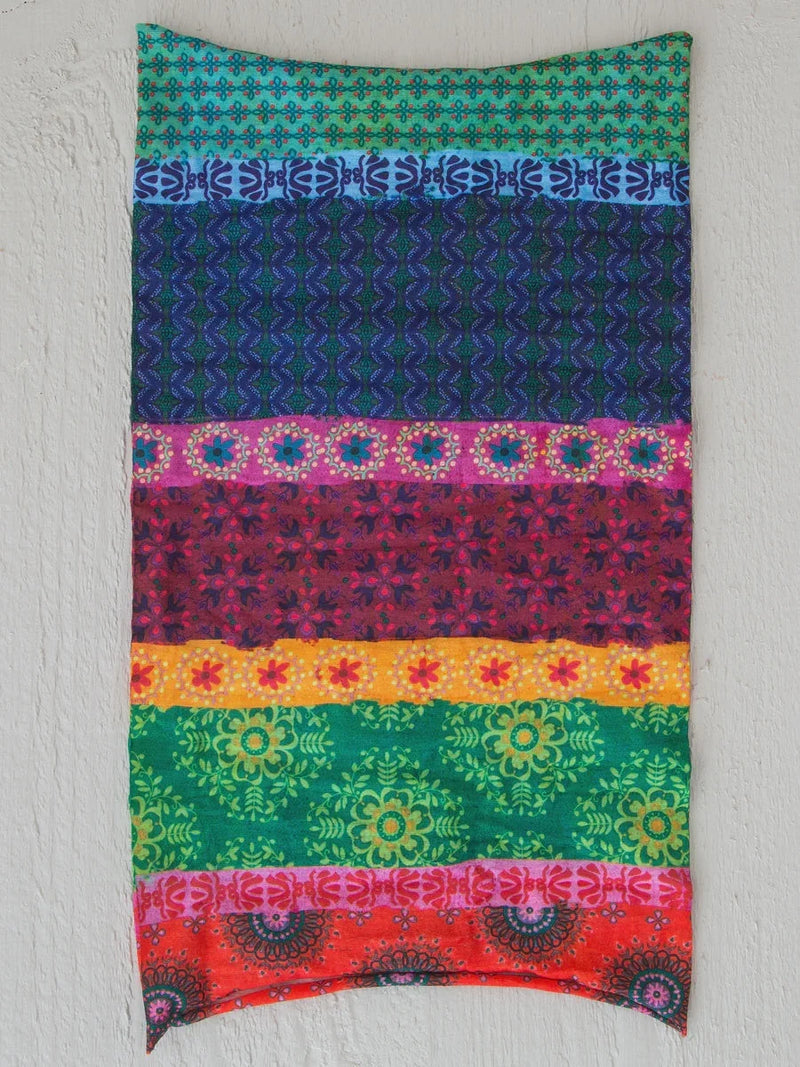 Colorful scarf displayed on wall showcasing FULL BOHO BANDEAU HEADBAND - MULTI STRIPE design