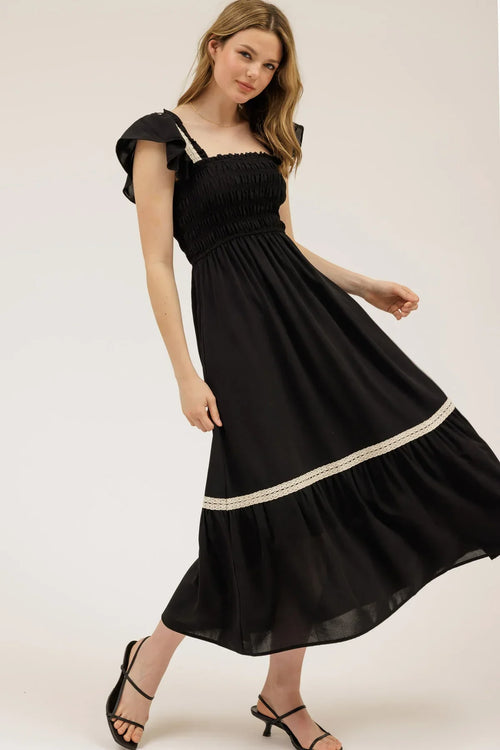 Black smocked ruffle midi dress with flutter sleeves and white lace trim
