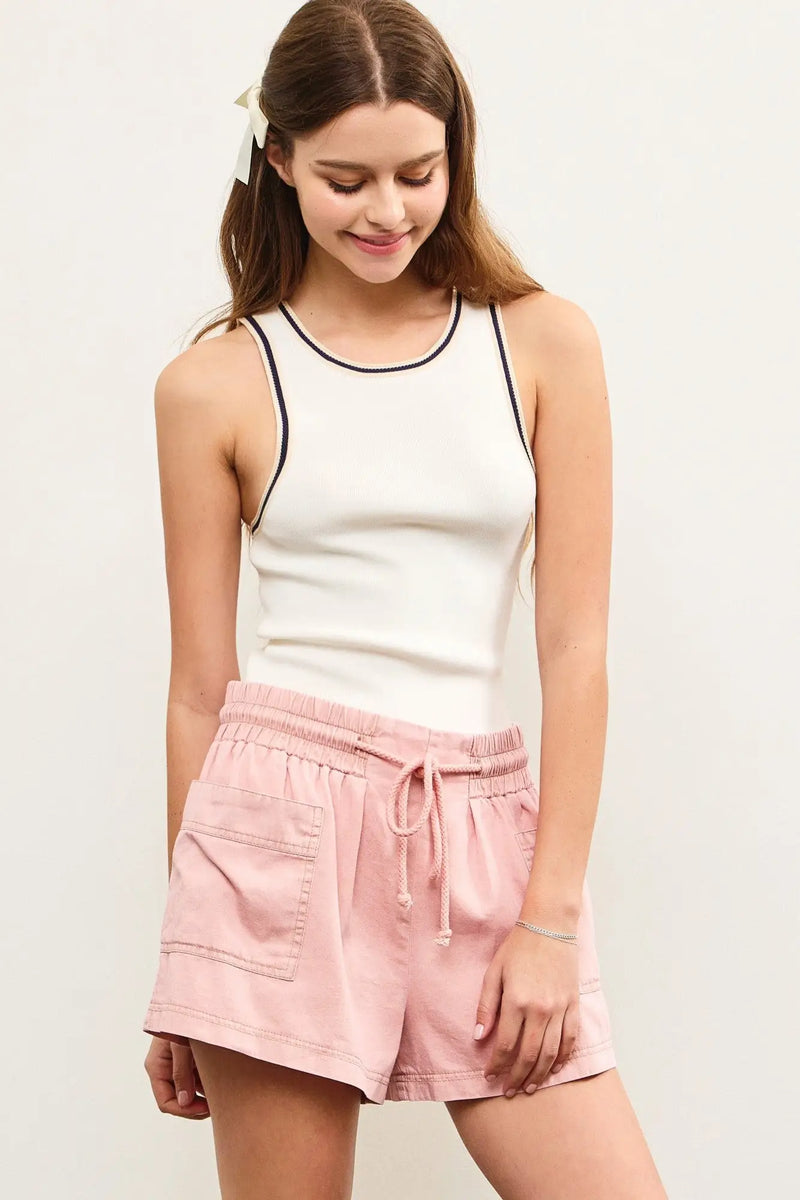 Woman’s pink drawstring shorts paired with a Contrast Edge Sleeveless Knit Top