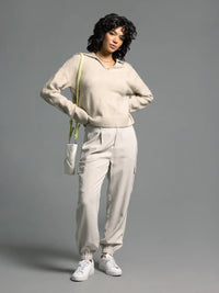Prudence Sweater: Cream cashmere hoodie, white cargo pants, green bag