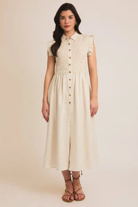 Cream-colored button-down midi dress with ruffle sleeves, perfect for stylish occasions