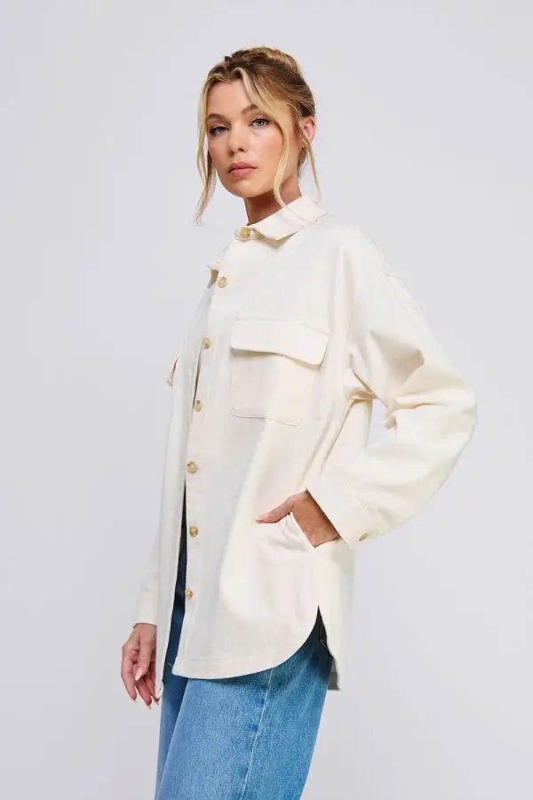 Cream-colored oversized denim twill shacket featuring button-down design