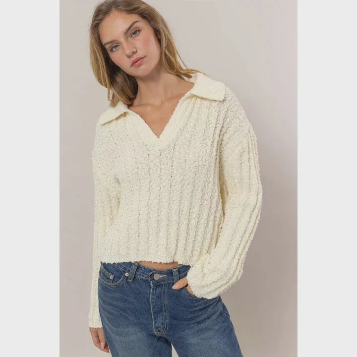 Cream-colored cable knit cropped sweater with collar in relaxed fit for women’s boho chic clothing