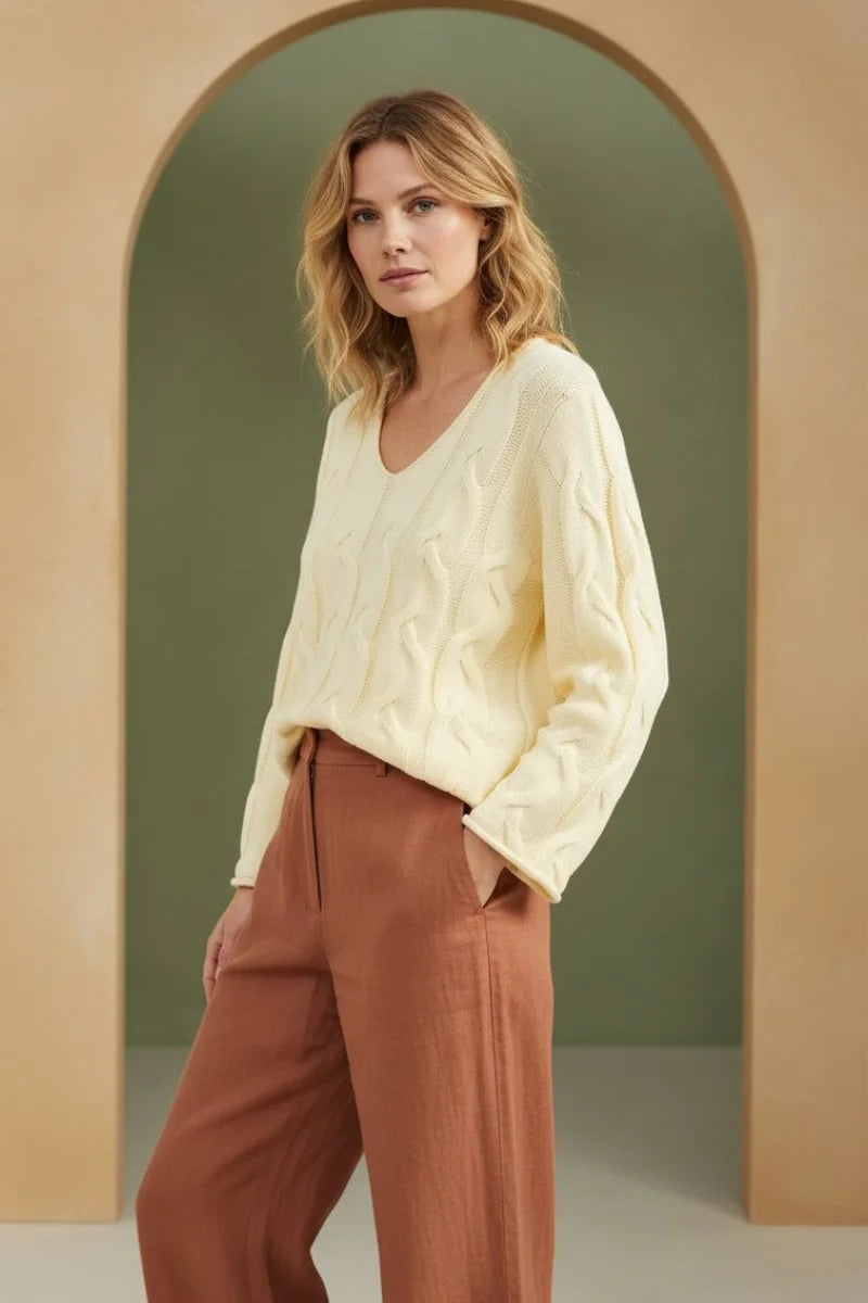 Cream-colored V-neck cable pullover sweater with long sleeves