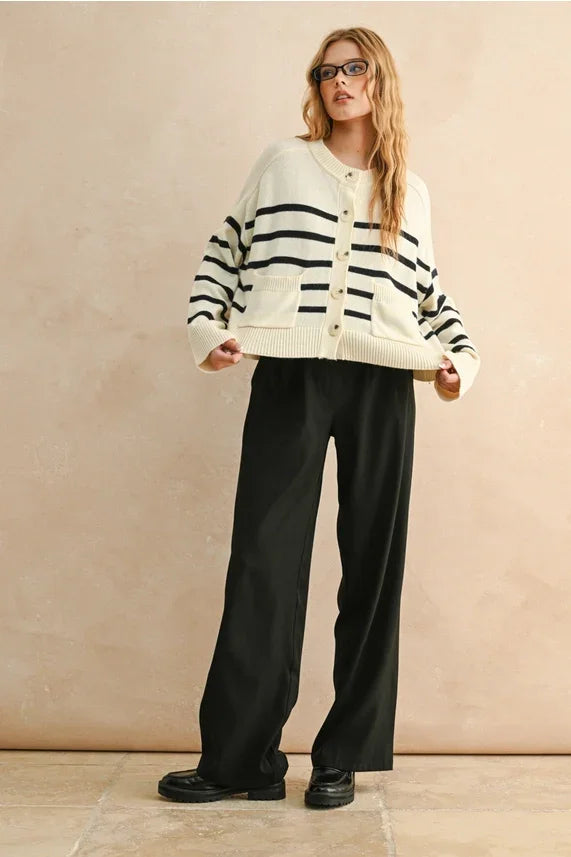 Cream-colored stripe pattern button front cardigan with black stripes