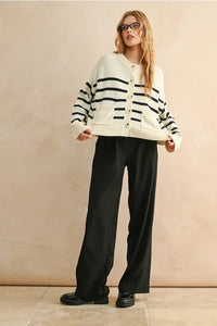 Cream-colored stripe pattern button front cardigan with black stripes