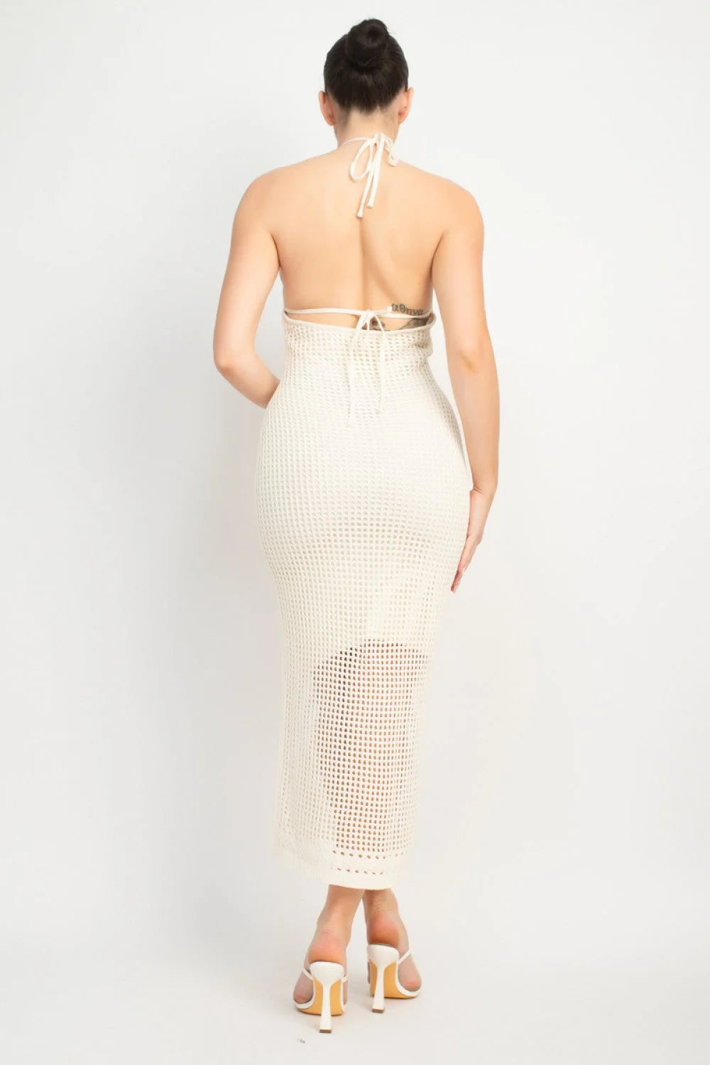 Cream-colored crochet maxi skirt on a woman, exuding a boho free spirit vibe