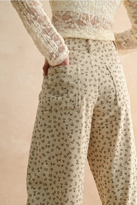 Cream-colored floral printed corduroy wide-leg pants for a stylish casual look