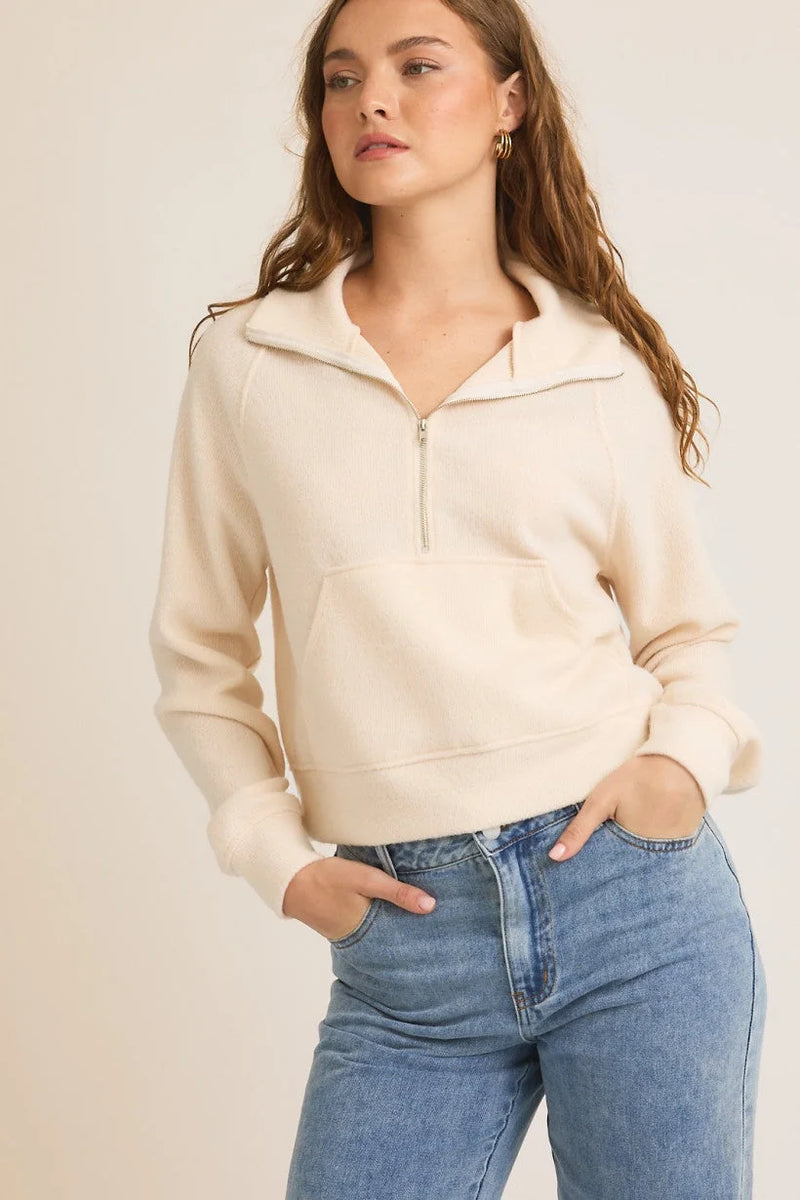 Cream-colored half-zip sweater in size small with blue jeans for women’s boho chic clothing