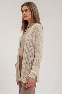 Cream-colored crochet knit cardigan with open front and pockets for stylish layering