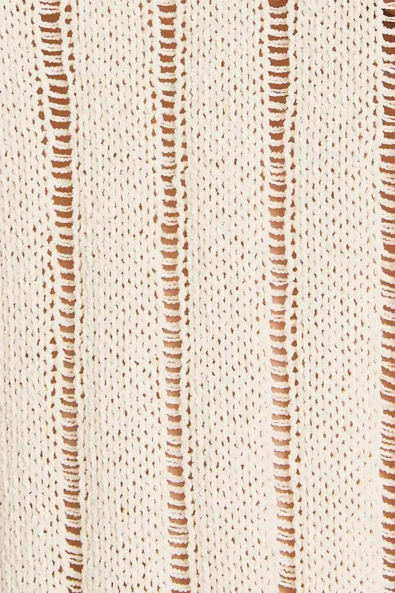 Cream-colored knit fabric with vertical openwork stripes for round neck long sleeve sweater