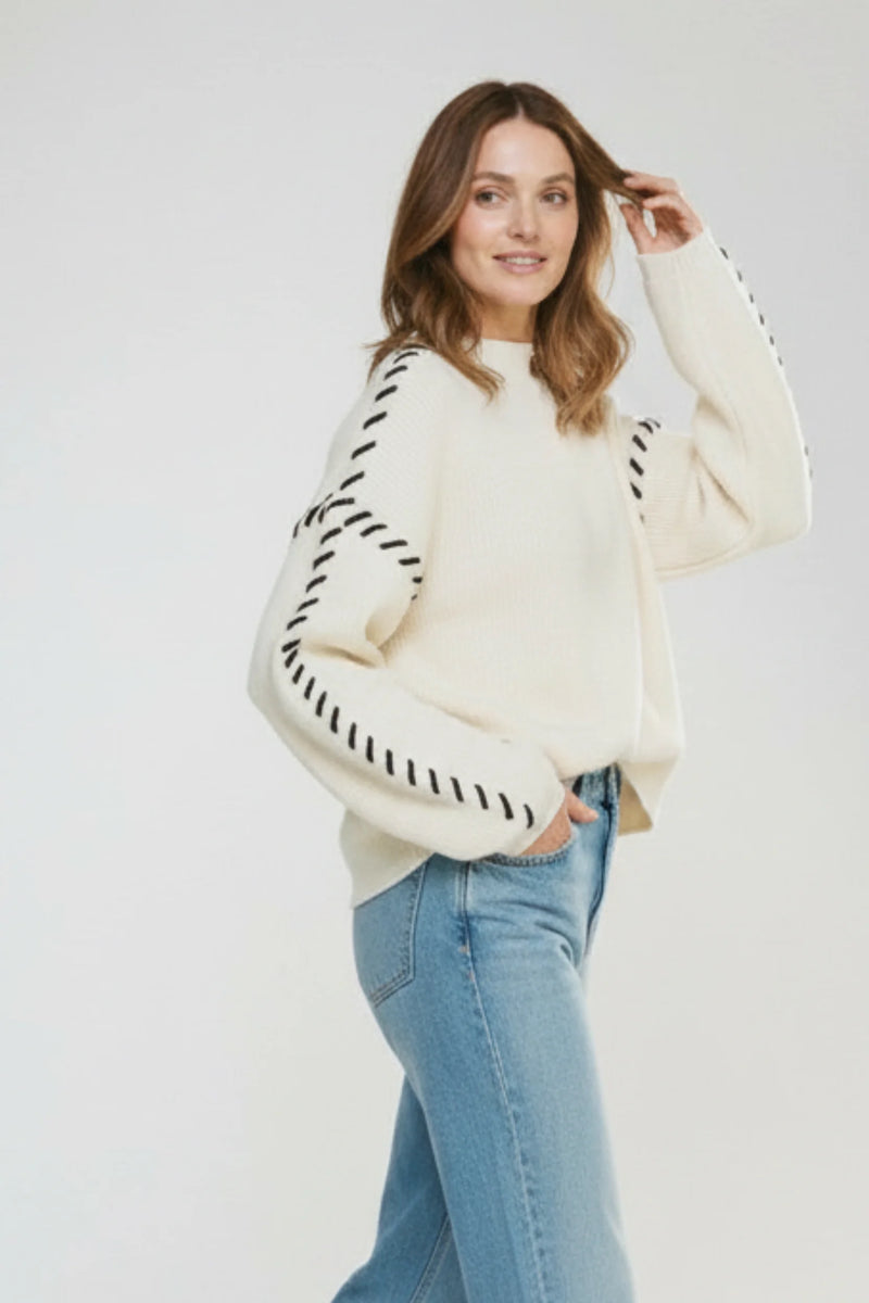 Cream Lofty Mock Neck Sweater with Black Sleeve Stitch Details