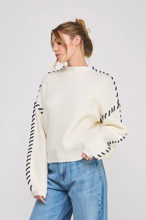 Lofty Mock Neck Cream Knit Sweater with Black Zigzag Stitch Details