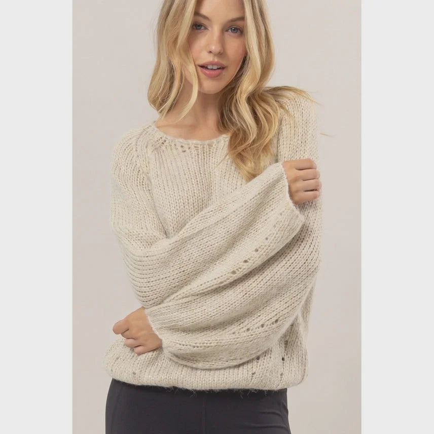 Cream-colored Melange Knit Sweater Pullover with a loose textured pattern for women’s boho chic clothing