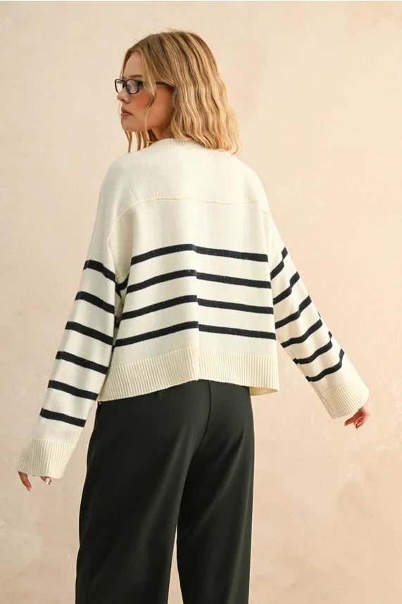 Cream-colored stripe pattern button front cardigan with black stripes