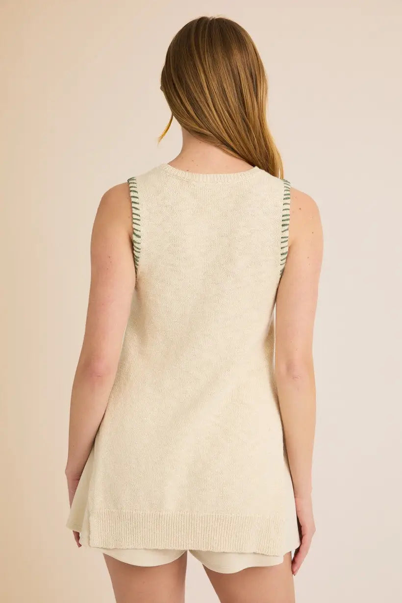 Cream-colored knit vest featuring round neck sleeveless design and side open stitch detail