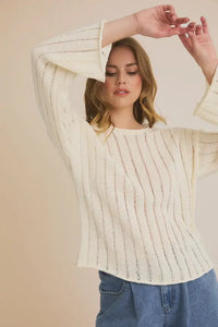 Cream-colored round neck long sleeve sweater, knit top ideal for stylish winter wear