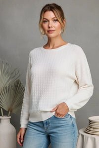 Cream-colored textured pointelle soft gauge dolman sweater